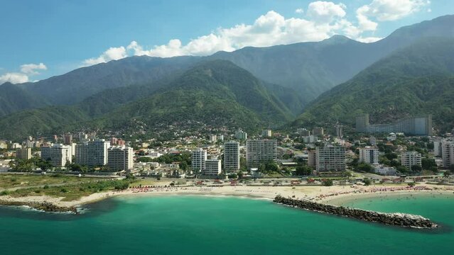 Aerial view picturesque public beach with turquoise water. Los Corales, La Guaira, Venezuela.