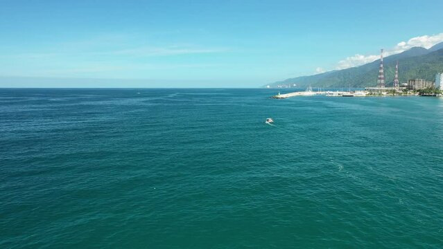 Aerial view of traditional fishing boat in Caraballeda with crystal clear turquoise sea, La Guaira, Venezuela.