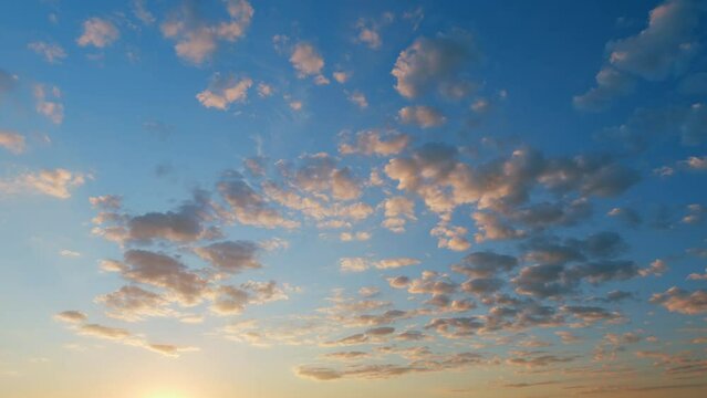 Beautiful sky with clouds background. Majestic sunset or sunrise landscape amazing light. Time lapse.