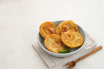 Pia Udang or Bakwan Udang, Indonesian snacks made from flour, carrots, leek and prawns
