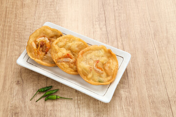 Pia Udang or Bakwan Udang, Indonesian snacks made from flour, carrots, leek and prawns
