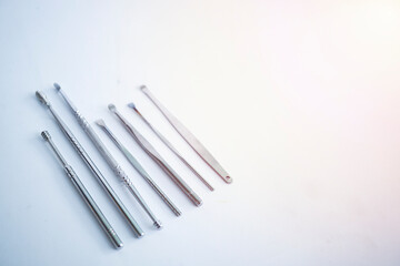 Tool set for cleaning ears isolated on a white background.