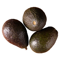 Mexican avocado (persea americana) on rustic wooden table. Main ingredient to prepare guacamole. Close up image with copy space.