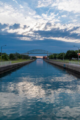 The Sault Ste. Marie Canal, running through St. Mary's River in Ontario, is seen during sunset.