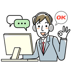 ヘッドセットをつけてパソコンに向かう若い男性