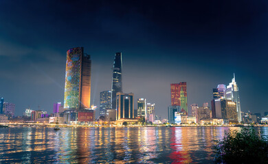 Obraz premium view of Bitexco and IFC One Tower, buildings, roads and Saigon river in Ho Chi Minh city - Laser and lighting show displayed. Travel and landscape concept.