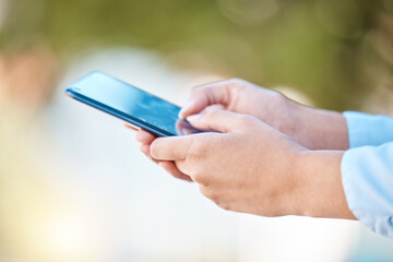 Communication, social media and a man typing on a phone in a park with bokeh. Contact, email and technology to talk to friends and family from any location with fast wifi or 5g internet connection