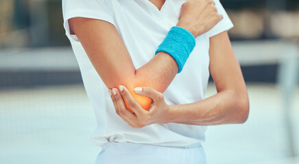 Tennis elbow, pain and injury with a sports woman holding her joint during training, workout and...