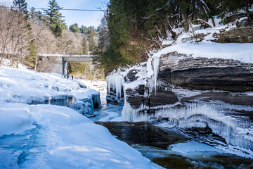 River and gorge in Pont Rouge village with ice stalactites on a winter day in Quebec (Canada)