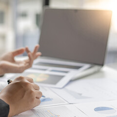 Financial businessmen analyze the graph of the company's performance to create profits and growth, Market research reports and income statistics, Financial and Accounting concept.