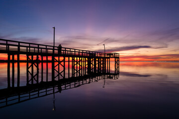Naklejka premium Pier on Mobile Bay at sunset in Daphne, Alabama
