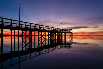 Fototapeta premium Pier on Mobile Bay at sunset in Daphne, Alabama