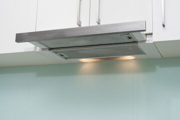 A clean range hood in the kitchen.