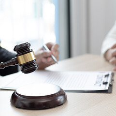Attorneys or consultants who work in the courtroom are currently investigating the company's corruption cases and have their clients sign legal confirmation, Litigation and justice concept.