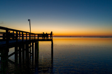 Naklejka na ściany i meble Pier on Mobile Bay at sunset in Daphne, Alabama