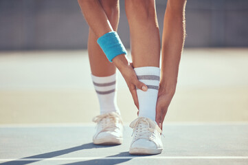 Tennis athlete with ankle injury, pain and hurt on a court after training, workout or practice...
