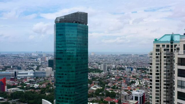 aerial skyline of apartment block near commercial high-rise building in Jakarta Indonesia