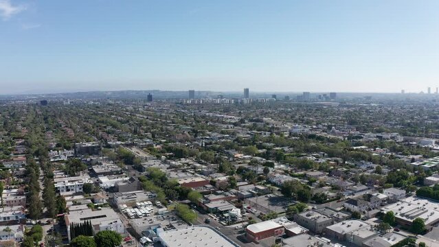 Wide dolly aerial shot of Wilshire Blvd. at Fairfax Ave. from Highland Ave. and Melrose Ave.. 4K