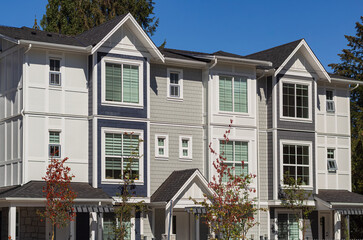 Fototapeta premium Brand new apartment building on sunny day in BC, Canada. Architectural details of modern apartment building