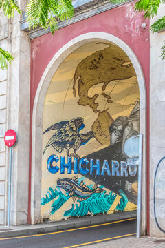 Santa Cruz de Tenerife, Spain - November 24, 2021: Arch of the General Serrador Bridge and a part of the Chicharro Worldwide mural in Santa Cruz de Tenerife. Street art in the Canary Islands
