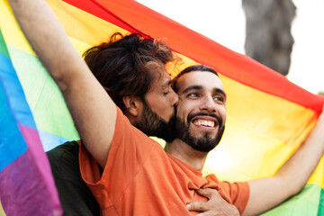 Obraz premium Happy couple with a pride flag. LGBT community.