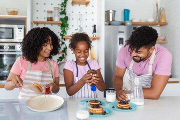 happy moments in the kitchen, close up photo, young cute family gets pleasure from spending time in the kitchen. close up photo