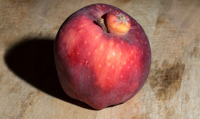 Red Delicious apple. Siamese twin, conjoined, parasitic, freak on the big apple.