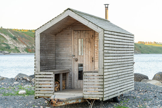 Outdoor wooden transportable sauna on the trailer with wheels