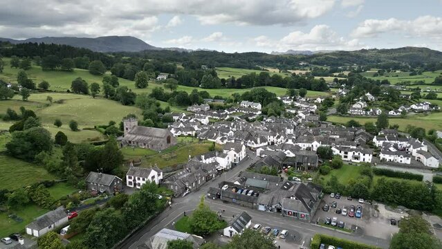 Drone, aerial footage of Hawkshead a ancient Village in the Lake District, Cumbria.
The village is still the same collection of tiny houses, and squares loved by Wordsworth and Beatrix Potter. England