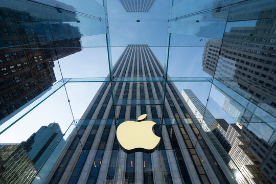 New York, NY, USA - July 9, 2022: Apple logo is seen at the Apple flagship store on the 5th Avenue in NYC. Apple, Inc. is an American multinational tech company headquartered in Cupertino, California.