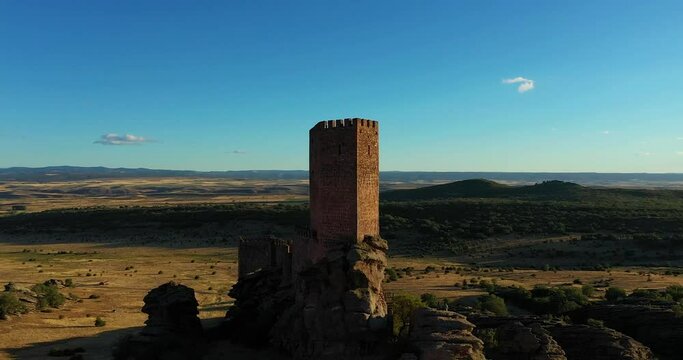 Tower Of Castillo de Zafra Against Blue Sky In Guadalajara, Spain - drone shot - Game of Thrones location