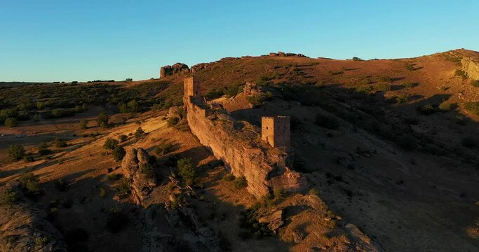 View Of Zafra Castle In Spain At Sunset With Blue Sky - aerial drone shot - Game of Thrones location