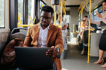 African american man working during commute