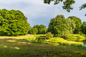 Beautiful park with mature trees and a pond