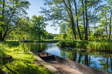 Water channel in the Spreewald Biosphere Reserve in Germany, with one of the typical wooden boats.
