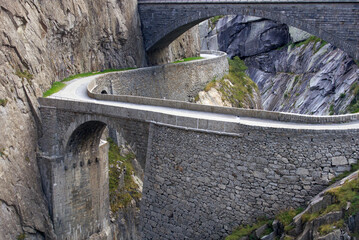 Famous Devil's Bridge at Schöllenen Gorge, Canton Uri, on a sunny summer day. Photo taken July...