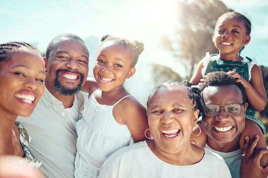 Portrait, happy black big family and love as they smile on vacation, trip or holiday. Ancestry, African people or grandparent, fathers and mother with kids together in the shining sun or sunshine.