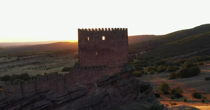 Scenic Sunset And The Ancient Castle of Zafra In Campillo de Due&ntilde;as, Guadalajara, Spain - drone shot  - Game of Thrones location