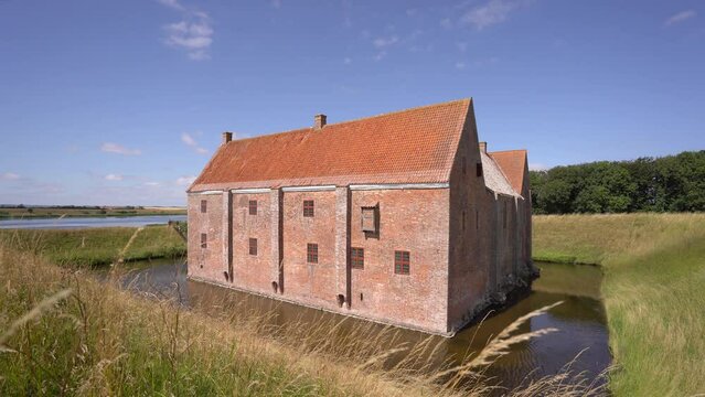 Spottrup Middle Age Castle With Its Moat, Ramparts and High Walls with Embrasures