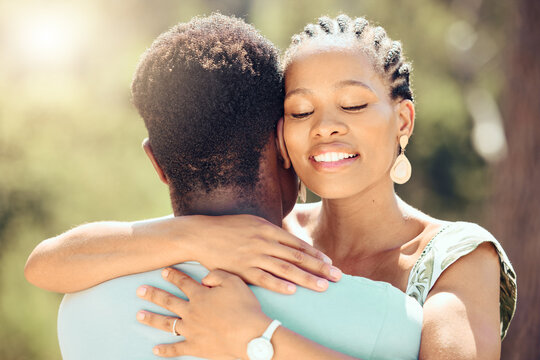 Love, relax and happy couple hug in nature for a save the date wedding announcement. Young man and woman happiness from Jamaica in the summer sunshine to show romance, trust and romantic partnership - Powered by Adobe