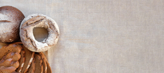 Baked bread. Loaf of Bread. Fresh Bakery Products on Wooden Board. Healthy Food Concept. Top View....