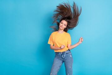Photo of sweet shiny girl dressed yellow t-shirt wind blowing hair flying dancing empty space...