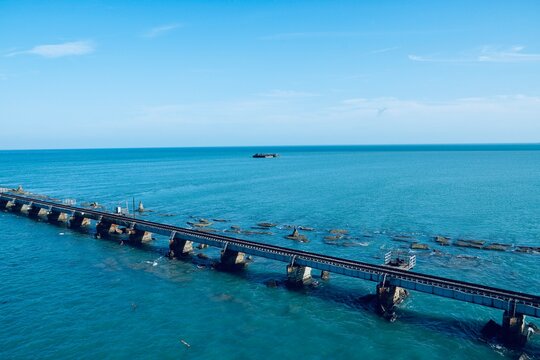 Pamban bridge at Rameshwaram, Tamilnadu. Railway bridge connects the small island in India. Blue sea water with transportation for ships in the middle of the sea.