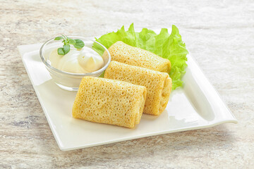 Stuffed pancakes with meat and cream