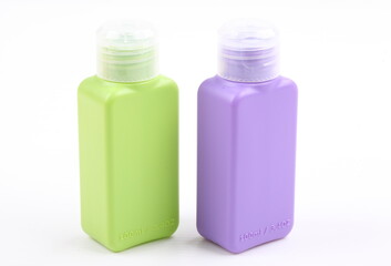 the bottle green and violet color packaging isolated on white background