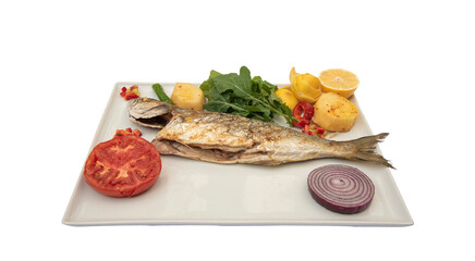 Bluefish and appetizers in white plate, standing on isolated background. (Lüfer)
