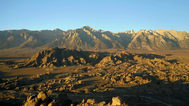 Jagged geological formations of Alabama Hills, Lone Pine, sunset aerial