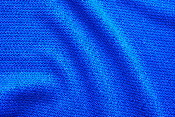Fototapeta premium Blue football jersey clothing fabric texture sports wear background, close up top view