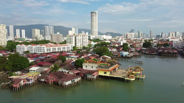 Penang, Malaysia: Aerial drone footage of the Hean Boo Thean Kuan Yin Temple by the Clan jetty in George Town, the colonial historic city in the island of Penang. Shot with a rotation motion.