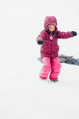 Fototapeta na wymiar little child playing with snow